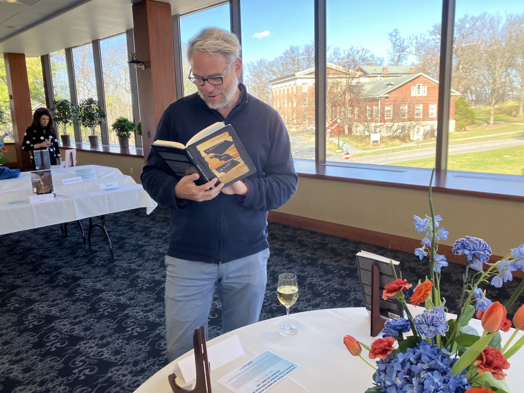 Bastian Heinsohn reading a book by his colleague, Or Rogovin. The book is entitled Created in the Image? Holocaust Perpetrators in Israeli Fiction.
